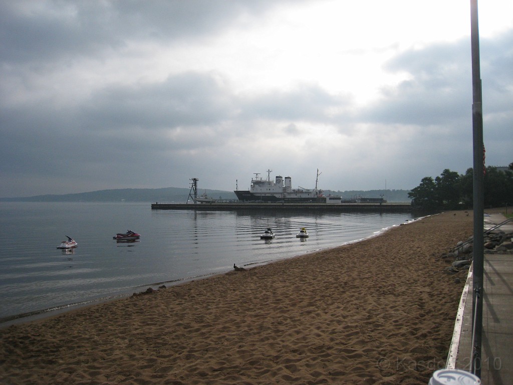 Michigan TC 2010-07 2410.jpg - Empty beach, idle jet ski's, calm water.